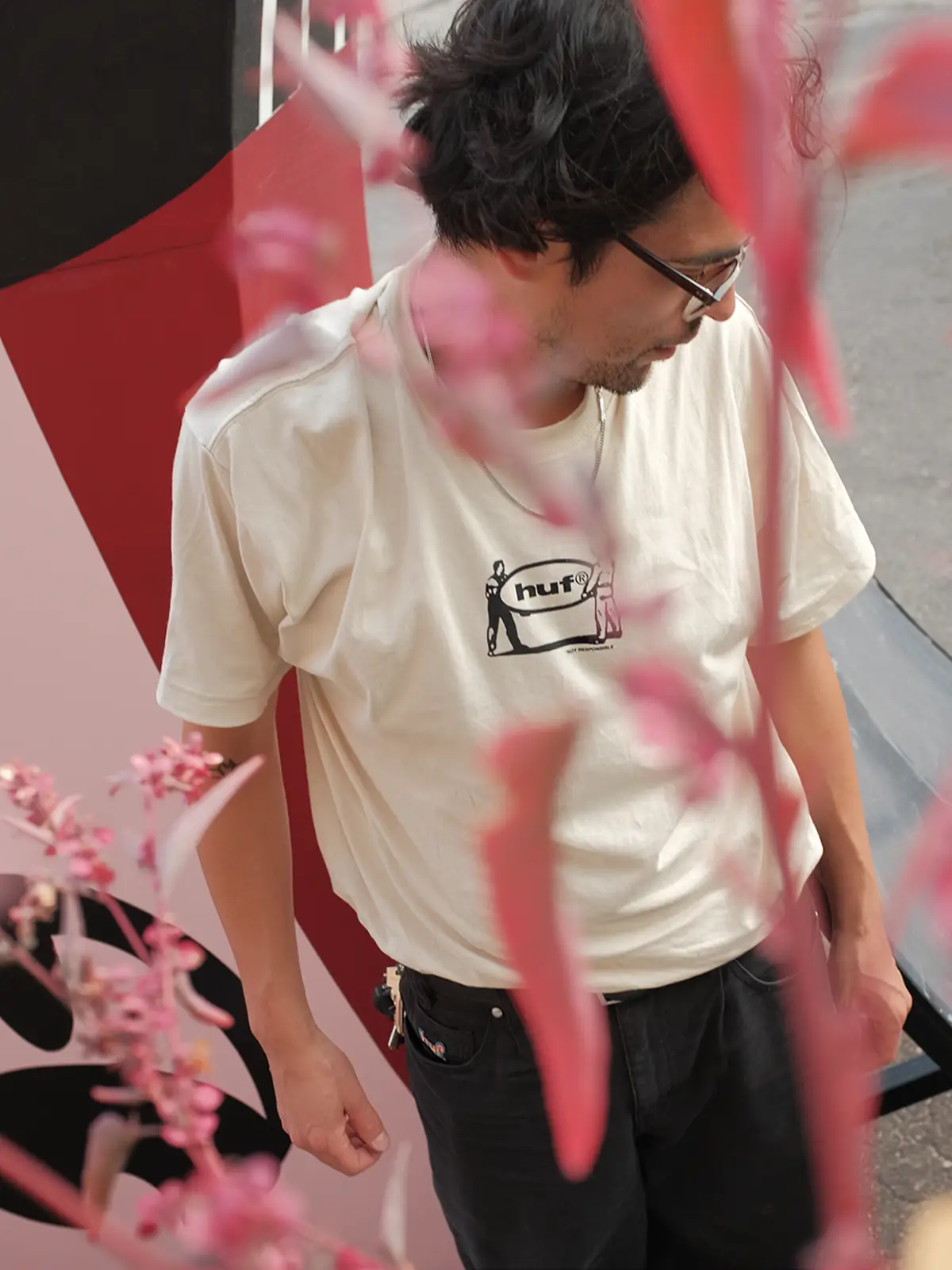 Portrait of the artist in front of his sculpture – huf® x Roberto Cuellar Campaign 2024